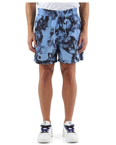 Versace Technische bermuda-shorts mit all-over-print - Blau