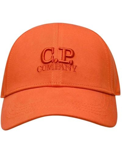 C.P. Company Cappello arancione con visiera e logo ricamato