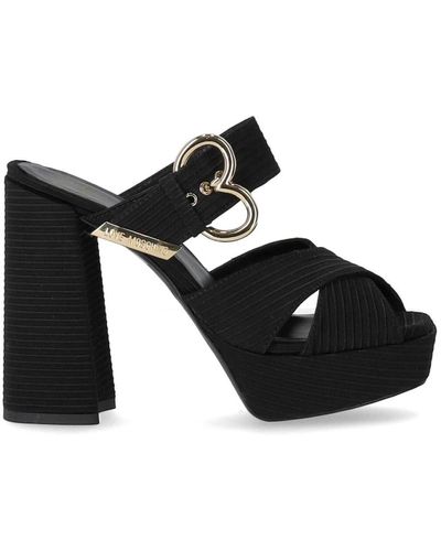 Love Moschino E Stoff-Sandalen mit gekreuzten Riemen und herzförmiger Schnalle - Schwarz