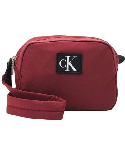 Calvin Klein Cross Body Bags - Red