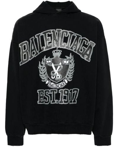 Balenciaga Schwarzer pullover mit logo-print und distressed-effekt