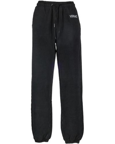 Versace Pantalones de chándal negros - corte oversize - 100% algodón