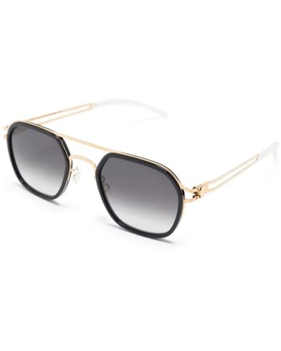 Mykita Stylische sonnenbrille in glänzendem gold schwarz - Mettallic