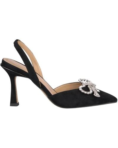 Alma En Pena. Pointed toe leather pumps with rhinestone bow - Negro