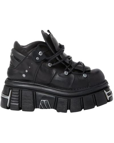Vetements Sneakers in pelle con piattaforma e placche logo - Nero