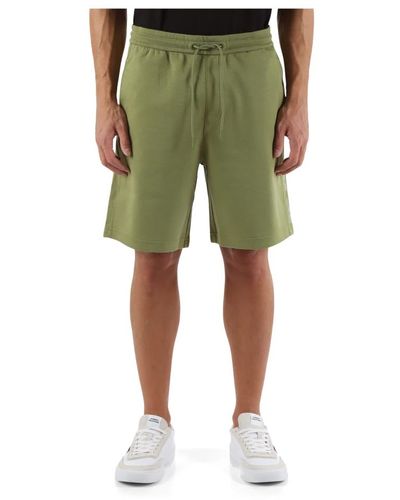 Calvin Klein Sportliche baumwollshorts mit seitlichem logoaufdruck - Grün