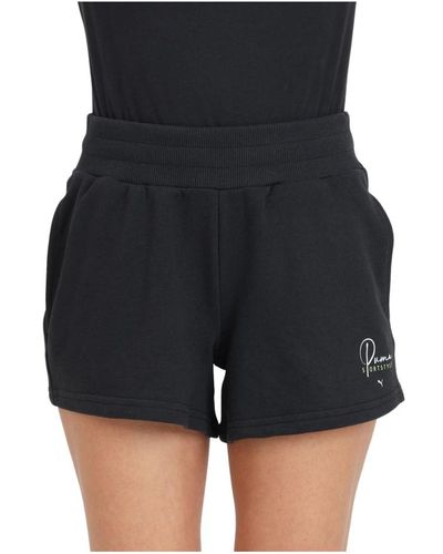 PUMA Shorts neri con stampa logo - Nero