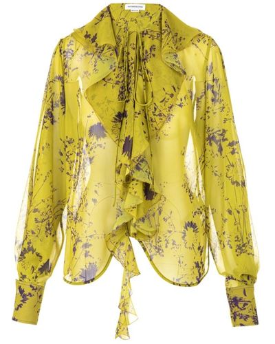 Victoria Beckham Eleva tu estilo con blusa romántica - Amarillo
