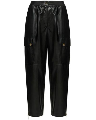 SIMONA CORSELLINI Pantalón cargo negro con detalles de metal dorado