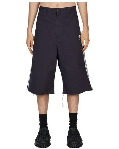 Balenciaga Zerrissene denim-shorts mit charakteristischen streifen - Blau