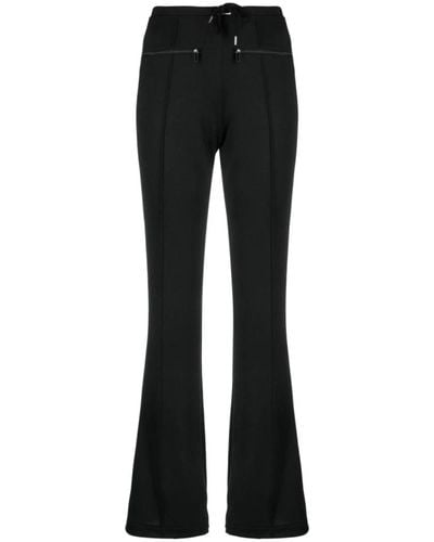 Courreges Pantalones negros con logo-patch flared