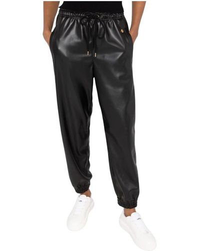 Stella McCartney Pantalones negros de cuero sintético