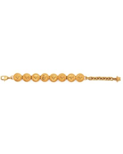 Versace Bracciale a catena dorata con ciondoli testa di medusa - Giallo