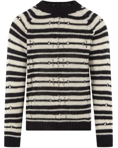 Dries Van Noten Gestreifter schwarzer und elfenbeinfarbener wollpullover mit durchbrochenen details