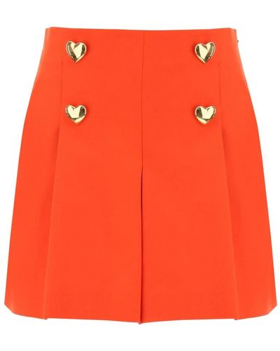 Moschino Shorts svasati con bottoni a forma di cuore - Arancione
