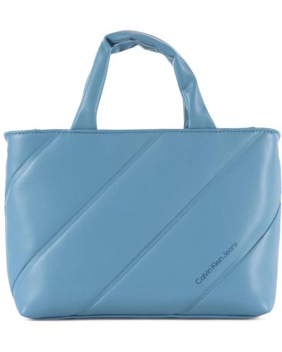 Calvin Klein Kleine handtasche mit frontlogo-druck - Blau