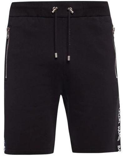 Balmain Shorts in cotone nero con logo stampato e tasche con zip