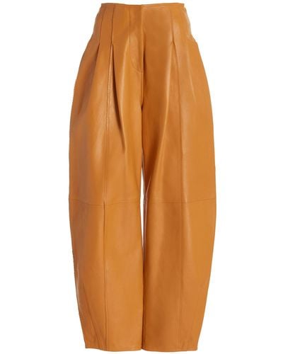 Ulla Johnson Sloane Pleated Tapered Wide-leg Leather Pants - Orange