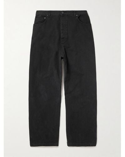 Balenciaga Hybrid weit geschnittene Hose aus Denim und Baumwollfleece in Distressed-Optik - Schwarz