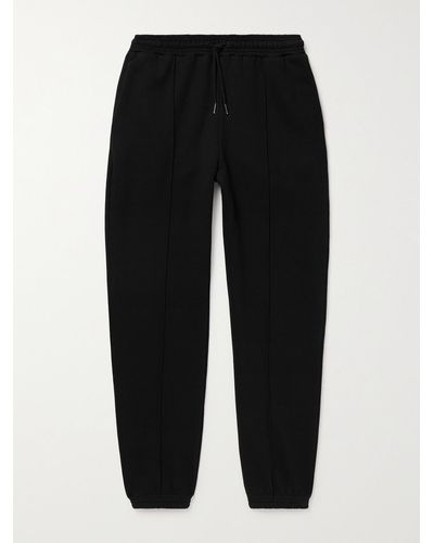 NINETY PERCENT Tapered Organic Cotton-jersey Drawstring Sweatpants - Black