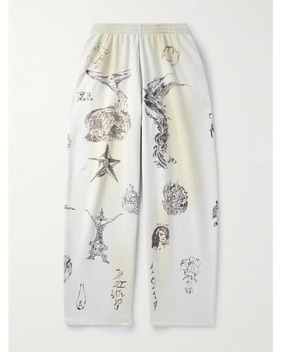 Balenciaga Pantaloni sportivi a gamba larga in jersey di cotone stampato effetto consumato - Bianco