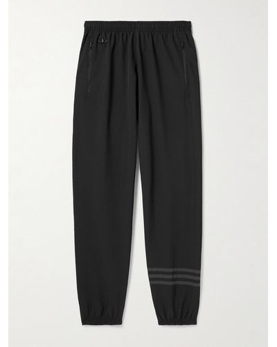 adidas Originals Pantaloni sportivi a gamba affusolata con righe Neuclassic - Nero