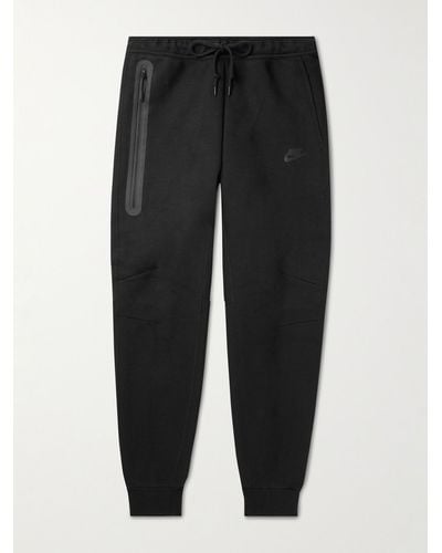Nike Pantaloni sportivi a gamba affusolata in Tech Fleece di misto cotone - Nero