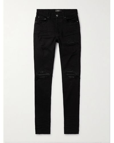 Amiri MX1 Skinny Jeans mit Einsätzen aus Leder in Distressed-Optik - Schwarz