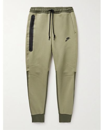 Nike Pantaloni sportivi a gamba affusolata in Tech Fleece di misto cotone - Verde