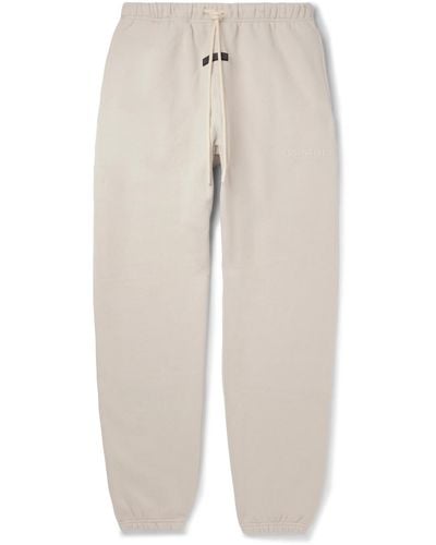 Fear Of God Tapered Logo-appliquéd Cotton-blend Jersey Sweatpants - Natural