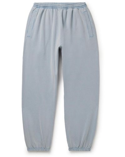 Acne Studios Tapered Logo-appliquéd Cotton-jersey Sweatpants - Blue