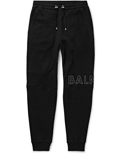 Balmain Slim-fit Tapered Reflective Logo-embossed Cotton-jersey Sweatpants - Black