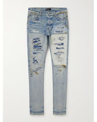 Amiri Skinny-fit Logo-embroidered Distressed Patchwork Jeans - Blue