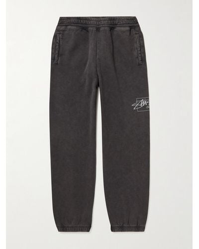 Stussy Tapered Garment-dyed Logo-print Cotton-jersey Joggers - Grey