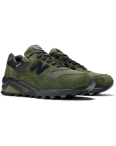 New Balance 580 in verde/nero/arancia