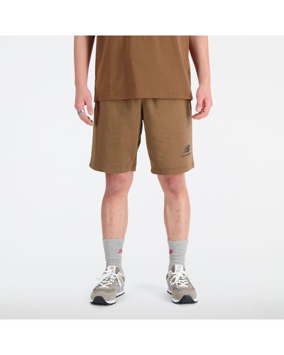 New Balance Essentials stacked logo french terry shorts in braun - Natur