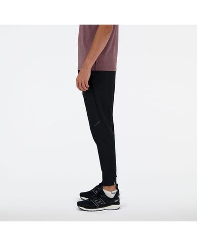 New Balance Tenacity Stretch Woven Pant In Black Polywoven