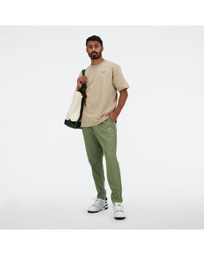New Balance Ac Tapered Pant 29" In Green Polywoven