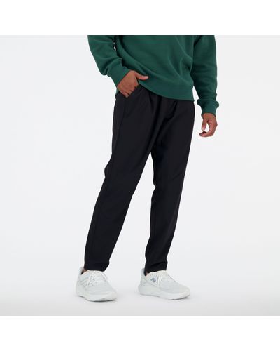 New Balance Ac Tapered Pant 29" In Black Polywoven
