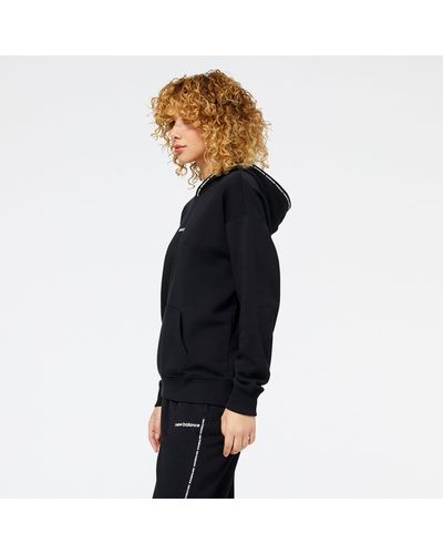 New Balance Nb essentials hoodie in nero - Blu