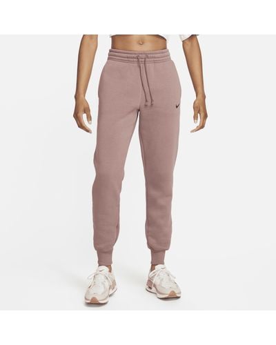 Nike Pantaloni tuta a vita media sportswear phoenix fleece - Rosa