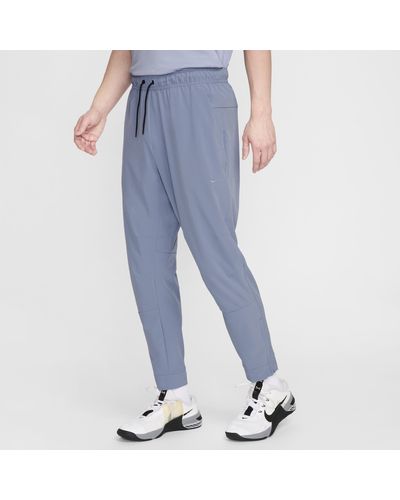 Nike Pantaloni versatili con zip sul bordo dri-fit unlimited - Blu