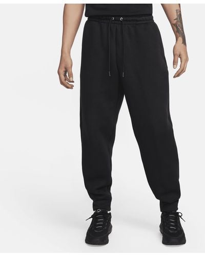Nike Pantaloni in fleece tech fleece reimagined - Nero