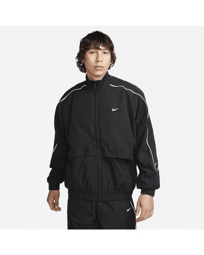 Nike Track jacket in tessuto sportswear solo swoosh - Nero