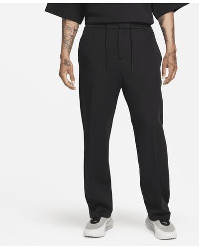 Nike Pantaloni tuta loose fit con orlo aperto sportswear tech fleece reimagined - Nero