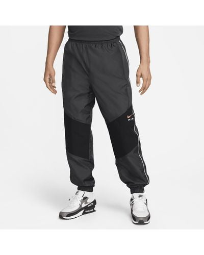Nike Pantaloni in tessuto air - Grigio