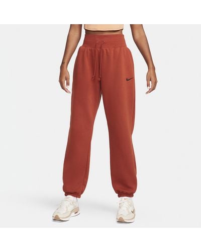 Nike Pantaloni tuta oversize a vita alta sportswear phoenix fleece - Rosso
