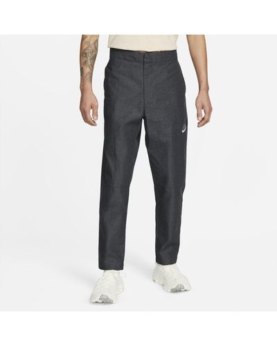 Nike Pantaloni sportswear woven - Grigio