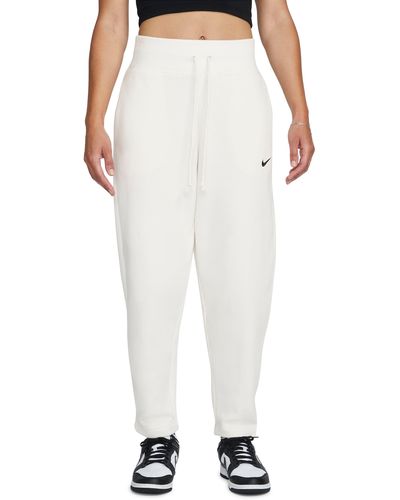 Nike Mini Swoosh Oversized High Rise joggers in White | Lyst