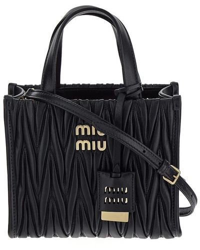 Cross body bags Miu Miu - Logo detailed matelassé leather small bag -  5BD140N88002